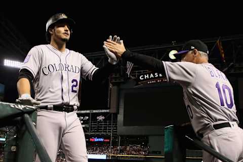 PHOENIX, AZ – MARCH 29: Nolan Arenado #28 of the Colorado Rockies high fives manager Bud Black #10 after hitting a solo home run against the Arizona Diamondbacks during the sixth inning of the opening day MLB game at Chase Field on March 29, 2018 in Phoenix, Arizona. (Photo by Christian Petersen/Getty Images)