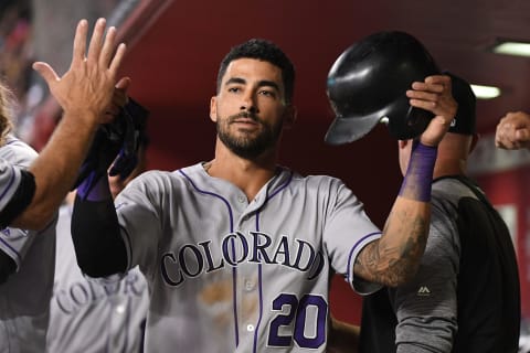 PHOENIX, AZ – SEPTEMBER 21: Ian Desmond #20 of the Colorado Rockies is congratulated in the dugout after driving in a run during the fifth inning of the MLB game against the Arizona Diamondbacks at Chase Field on September 21, 2018 in Phoenix, Arizona. (Photo by Jennifer Stewart/Getty Images)