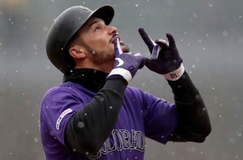 DENVER, COLORADO – MAY 09: Nolan Arenado #28 of the Colorado Rockies celebrates after crossing home plate after hitting a 2 RBI home run in the first inning against the San Francisco Giants at Coors Field on May 09, 2019 in Denver, Colorado. (Photo by Matthew Stockman/Getty Images)