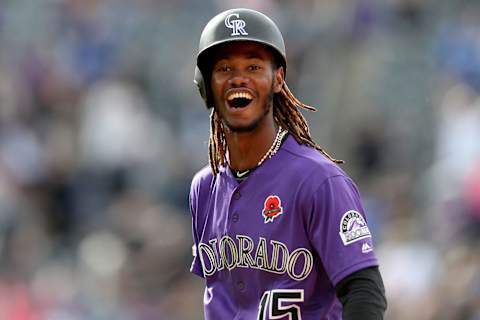 DENVER, COLORADO – MAY 27: Raimel Tapia #15 of the Colorado Rockies celebrates hitting a walk off single to drive in the wining run in the 11th inning against the Arizona Diamondbacks at Coors Field on May 27, 2019 in Denver, Colorado. (Photo by Matthew Stockman/Getty Images)