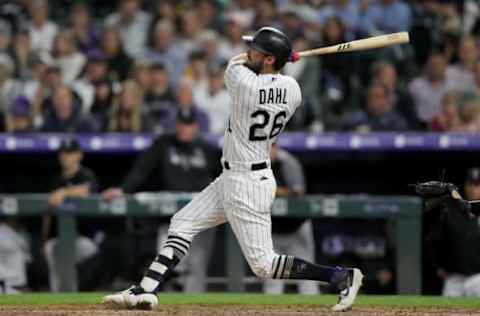 DENVER, COLORADO – JUNE 15: David Dahl #26 of the Colorado Rockies hits a triple in the seventh inning against the San Diego Padres at Coors Field on June 15, 2019 in Denver, Colorado. (Photo by Matthew Stockman/Getty Images)