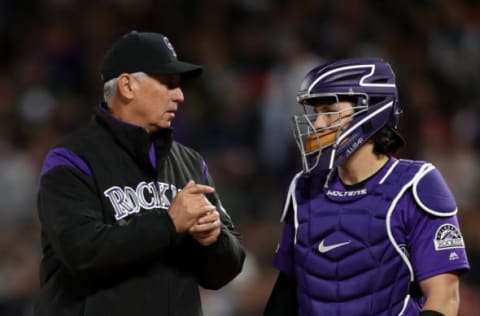 DENVER, COLORADO – APRIL 18: Manager Bud Black and catcher Tony Wolters #14 of the Colorado Rockies confer on the mound while changing pitchers in the seventh inning against the Philadelphia Phillies at Coors Field on April 18, 2019 in Denver, Colorado. (Photo by Matthew Stockman/Getty Images)