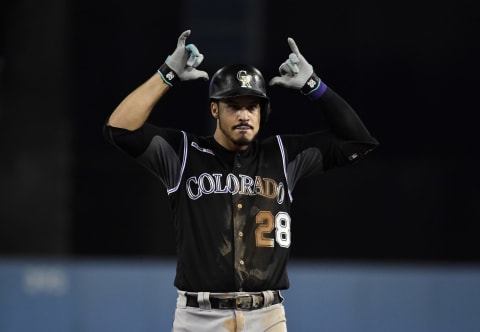 LOS ANGELES, CA – SEPTEMBER 04: Nolan Arenado #28 of the Colorado Rockies reacts after hitting a base hit off of starting pitcher Hyun-Jin Ryu #99 of the Los Angeles Dodgers during the fifth inning at Dodger Stadium on September 4, 2019 in Los Angeles, California. (Photo by Kevork Djansezian/Getty Images)