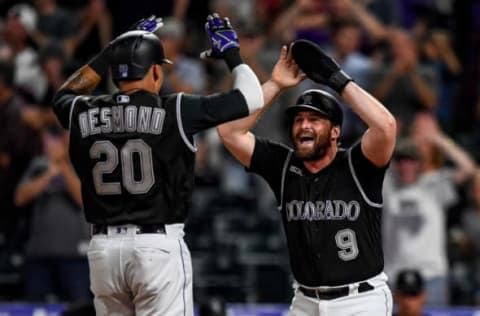 DENVER, CO – JULY 16: Ian Desmond #20 and Daniel Murphy #9 of the Colorado Rockies celebrate scoring on a Desmond home run, tying the game in the ninth inning against the San Francisco Giants at Coors Field on July 16, 2019 in Denver, Colorado. (Photo by Dustin Bradford/Getty Images)