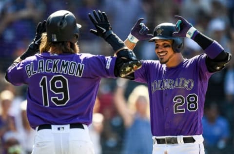 DENVER, CO – AUGUST 18: Nolan Arenado #28 of the Colorado Rockies celebrates with Charlie Blackmon #19 after hitting an eighth inning two-run home run against the Miami Marlins at Coors Field on August 18, 2019 in Denver, Colorado. (Photo by Dustin Bradford/Getty Images)