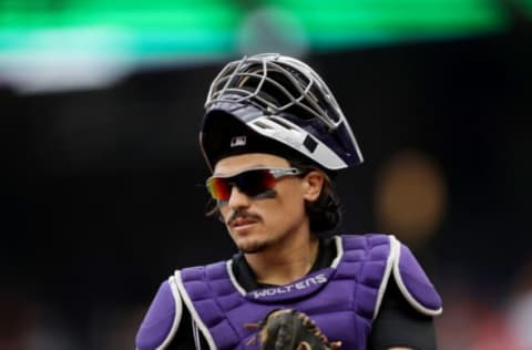 WASHINGTON, DC – JULY 25: Catcher Tony Wolters #14 of the Colorado Rockies looks on against the Washington Nationals at Nationals Park on July 25, 2019 in Washington, DC. (Photo by Rob Carr/Getty Images)