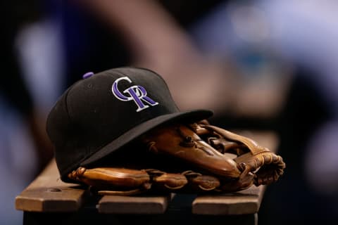 Jun 20, 2017; Denver, CO, USA; A general view of a Colorado Rockies hat and glove in the sixth inning of the game against the Arizona Diamondbacks at Coors Field. Mandatory Credit: Isaiah J. Downing-USA TODAY Sports