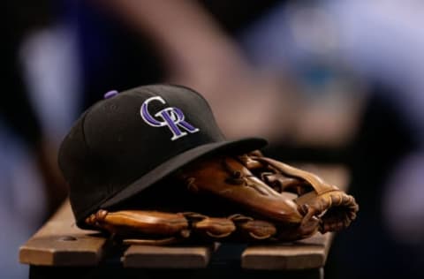 Jun 20, 2017; Denver, CO, USA; A general view of a Colorado Rockies hat and glove in the sixth inning of the game against the Arizona Diamondbacks at Coors Field. Mandatory Credit: Isaiah J. Downing-USA TODAY Sports