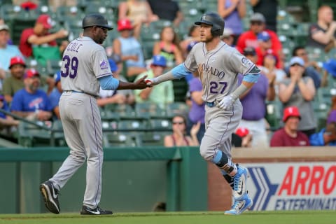 Jun 17, 2018; Arlington, TX, USA; Colorado Rockies shortstop Trevor Story (27) hits a home run in the top of the ninth against the Texas Rangers at Globe Life Park in Arlington. Mandatory Credit: Andrew Dieb-USA TODAY Sports