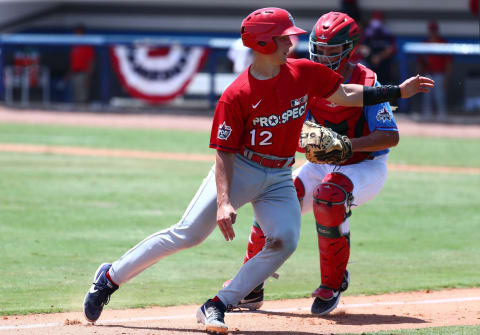 Jun 21, 2019; Bradenton, FL, USA; Team Howard catcher Drew Romo (20) tags out Team Larkin catcher Jackson Miller (12) during the ninth inning at IMG Academy. Mandatory Credit: Kim Klement-USA TODAY Sports