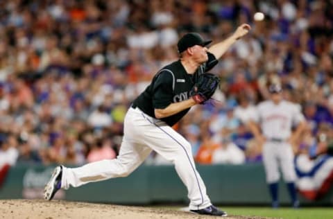 Jul 2, 2019; Denver, CO, USA; Colorado Rockies relief pitcher Jake McGee (51) pitches in the seventh inning against the Houston Astros at Coors Field. Mandatory Credit: Isaiah J. Downing-USA TODAY Sports