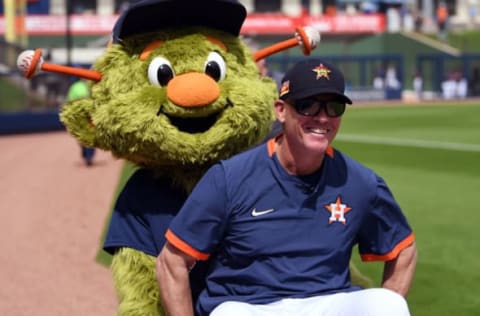 Feb 26, 2020; West Palm Beach, Florida, USA; Houston Astros guest spring training instructor Craig Biggio gets a ride from the Astros mascot Orbit before the game against the St. Louis Cardinals at FITTEAM Ballpark of the Palm Beaches. Mandatory Credit: Jim Rassol-USA TODAY Sports