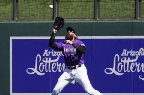 Mar 3, 2020; Salt River Pima-Maricopa, Arizona, USA; Colorado Rockies right fielder Charlie Blackmon (19) makes a running catch for an out against the Chicago Cubs during a spring training game at Salt River Fields at Talking Stick. Mandatory Credit: Rick Scuteri-USA TODAY Sports