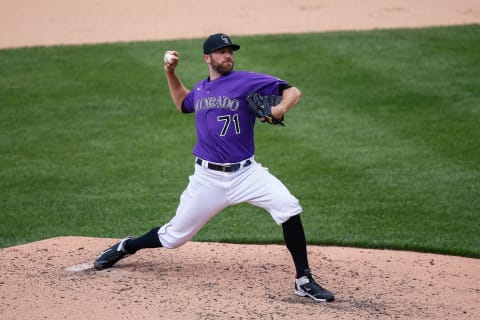 Jul 8, 2020; Denver, Colorado, United States; Colorado Rockies relief pitcher Wade Davis (71) pitches during workouts at Coors Field. Mandatory Credit: Isaiah J. Downing-USA TODAY Sports