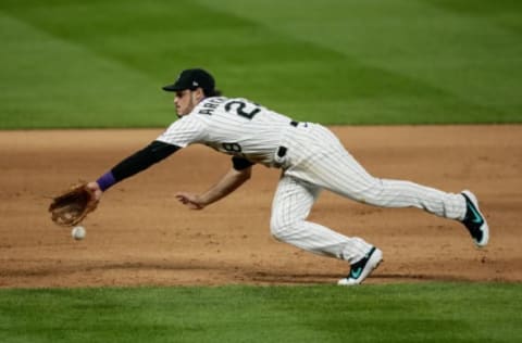 Aug 4, 2020; Denver, Colorado, USA; Colorado Rockies third baseman Nolan Arenado (28) is unable to field the ball in the eighth inning against the San Francisco Giants at Coors Field. Mandatory Credit: Isaiah J. Downing-USA TODAY Sports