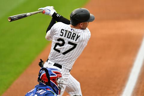 Aug 15, 2020; Denver, Colorado, USA; Colorado Rockies shortstop Trevor Story (27) triples in the first inning against the Texas Rangers at Coors Field. Mandatory Credit: Ron Chenoy-USA TODAY Sports