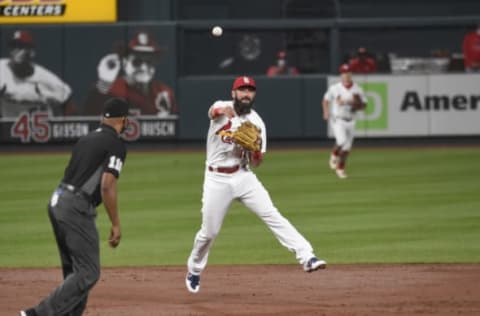 Aug 21, 2020; St. Louis, Missouri, USA; St. Louis Cardinals third baseman Matt Carpenter (13) throws to first for an out against the Cincinnati Reds during the third inning at Busch Stadium. Mandatory Credit: Joe Puetz-USA TODAY Sports