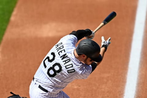 Sep 2, 2020; Denver, Colorado, USA; Colorado Rockies third baseman Nolan Arenado (28) singles in the first inning against the San Francisco Giants at Coors Field. Mandatory Credit: Ron Chenoy-USA TODAY Sports