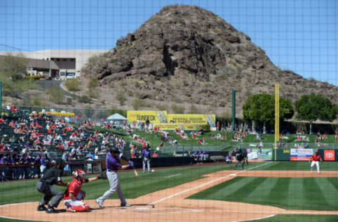 Mar 6, 2021; Tempe, Arizona, USA; Colorado Rockies designated hitter C.J. Cron bats against the Los Angeles Angels during the fourth inning of a spring training game at Tempe Diablo Stadium. Credit: Joe Camporeale-USA TODAY Sports