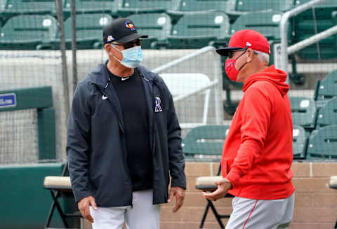 Mar 25, 2021; Salt River Pima-Maricopa, Arizona, USA; Colorado Rockies manger Bud Black and Los Angeles Angels manager Joe Maddon talk before a spring training game at Salt River Fields at Talking Stick. Mandatory Credit: Rick Scuteri-USA TODAY Sports