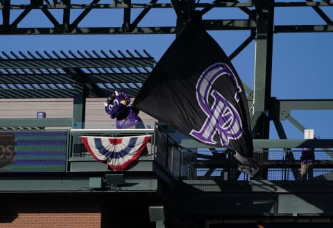 Apr 3, 2021; Denver, Colorado, USA; Colorado Rockies mascot Dinger performs before a game against the Los Angeles Dodgers at Coors Field. Mandatory Credit: Ron Chenoy-USA TODAY Sports