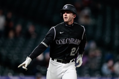 Colorado Rockies third baseman Ryan McMahon (24) gestures as he rounds the bases on a solo home run in the second inning against the Arizona Diamondbacks at Coors Field. Mandatory Credit: Isaiah J. Downing-USA TODAY Sports