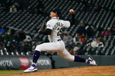 Apr 20, 2021; Denver, Colorado, USA; Colorado Rockies relief pitcher Robert Stephenson (29) delivers a pitch in the ninth inning against the Houston Astros at Coors Field. Mandatory Credit: Ron Chenoy-USA TODAY Sports