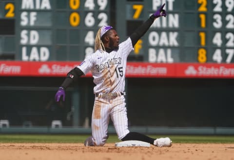 Apr 25, 2021; Denver, Colorado, USA; Colorado Rockies left fielder Raimel Tapia (15) celebrates his RBI double in the fourth inning against the Philadelphia Phillies Coors Field. Mandatory Credit: Ron Chenoy-USA TODAY Sports