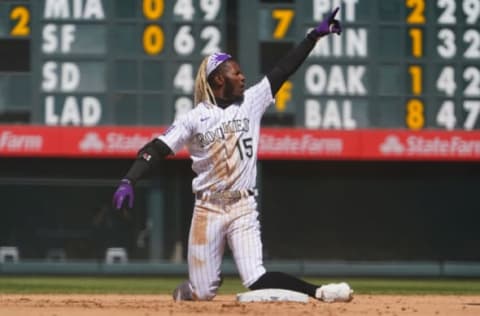 Apr 25, 2021; Denver, Colorado, USA; Colorado Rockies left fielder Raimel Tapia (15) celebrates his RBI double in the fourth inning against the Philadelphia Phillies Coors Field. Mandatory Credit: Ron Chenoy-USA TODAY Sports