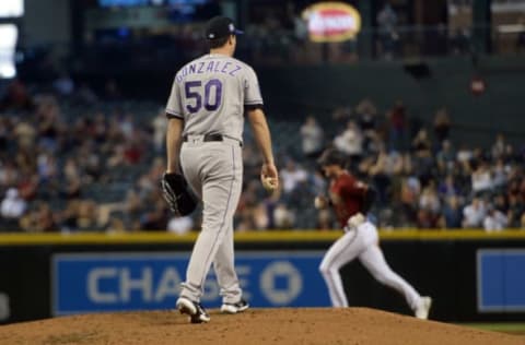 May 2, 2021; Phoenix, Arizona, USA; Colorado Rockies starting pitcher Chi Chi Gonzalez (50) reacts after giving up a two run home run to Arizona Diamondbacks first baseman Pavin Smith (26) during the fifth inning at Chase Field. Mandatory Credit: Joe Camporeale-USA TODAY Sports