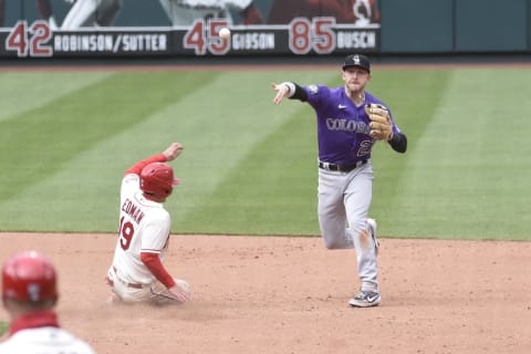 May 8, 2021; St. Louis, Missouri, USA; St. Louis Cardinals second baseman Tommy Edman (19) is out at seconds as Colorado Rockies shortstop Trevor Story (27) turns a double play in the sixth inning at Busch Stadium. Mandatory Credit: Joe Puetz-USA TODAY Sports