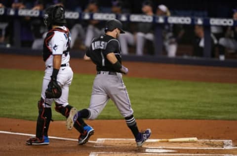 Jun 8, 2021; Miami, Florida, USA; Colorado Rockies center fielder Garrett Hampson (1) scores a run in the 1st inning against the Miami Marlins at loanDepot park. Mandatory Credit: Jasen Vinlove-USA TODAY Sports