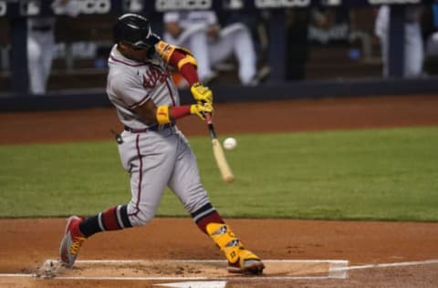 Jun 13, 2021; Miami, Florida, USA; Atlanta Braves right fielder Ronald Acuna Jr. (13) singles in the 1st inning against the Miami Marlins at loanDepot park. Mandatory Credit: Jasen Vinlove-USA TODAY Sports