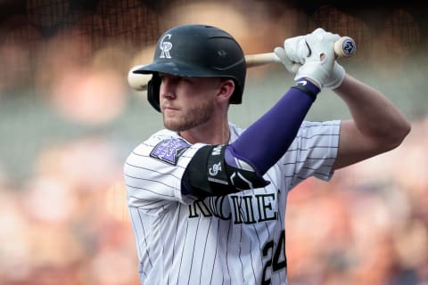 Jun 15, 2021; Denver, Colorado, USA; Colorado Rockies third baseman Ryan McMahon (24) on deck in the first inning against the San Diego Padres at Coors Field. Mandatory Credit: Isaiah J. Downing-USA TODAY Sports