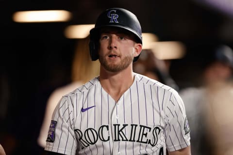 Jun 15, 2021; Denver, Colorado, USA; Colorado Rockies third baseman Ryan McMahon (24) reacts in the dugout after hitting a two run home run in the sixth inning against the San Diego Padres at Coors Field. Mandatory Credit: Isaiah J. Downing-USA TODAY Sports