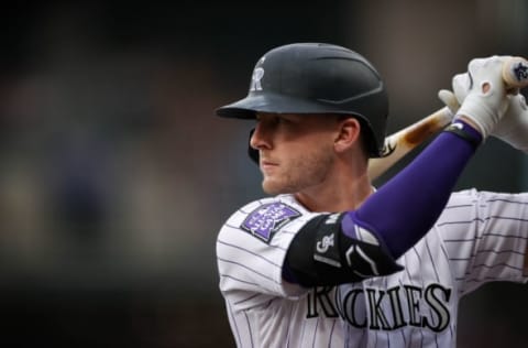 Jun 18, 2021; Denver, Colorado, USA; Colorado Rockies third baseman Ryan McMahon (24) warms up on deck in the first inning against the Milwaukee Brewers at Coors Field. Mandatory Credit: Isaiah J. Downing-USA TODAY Sports