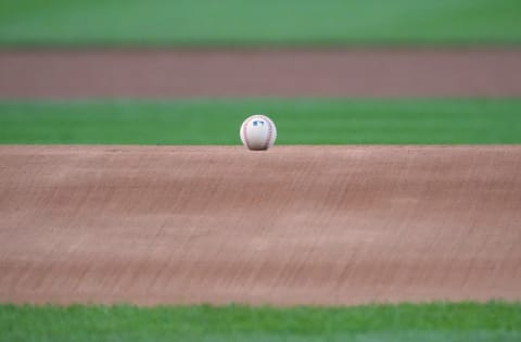 Jun 19, 2021; Denver, Colorado, USA; Detailed view of a MLB baseball on the top of the mound at Coors Field before a game between the Milwaukee Brewers against the Colorado Rockies. Mandatory Credit: Ron Chenoy-USA TODAY Sports