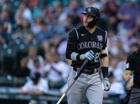 Jun 22, 2021; Seattle, Washington, USA; Colorado Rockies designated hitter Trevor Story (27) walks off the field after an at-bat during a game against the Seattle Mariners at T-Mobile Park. The Mariners won 2-1. Mandatory Credit: Stephen Brashear-USA TODAY Sports