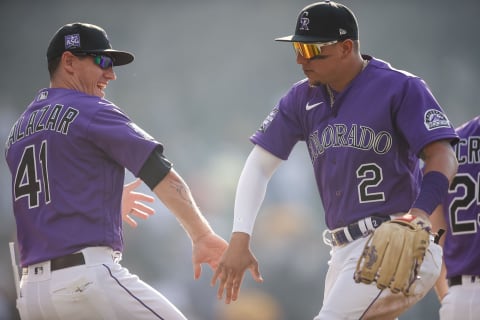 Jun 28, 2021; Denver, Colorado, USA; Colorado Rockies center fielder Yonathan Daza (2) celebrates with assistant hitting coach Jeff Salazar (41) after the game against the Pittsburgh Pirates at Coors Field. Mandatory Credit: Isaiah J. Downing-USA TODAY Sports