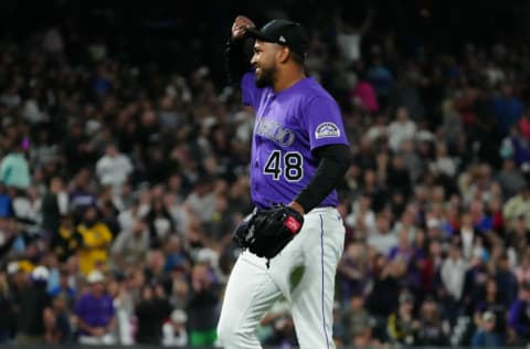 Jun 29, 2021; Denver, Colorado, USA; Colorado Rockies starting pitcher German Marquez (48) celebrates defeating the Pittsburgh Pirates at Coors Field. Mandatory Credit: Ron Chenoy-USA TODAY Sports