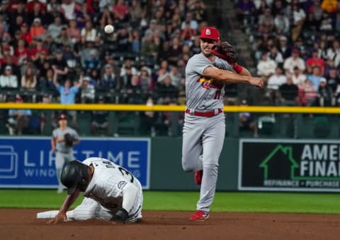 Jul 1, 2021; Denver, Colorado, USA; St. Louis Cardinals shortstop Paul DeJong (11) makes a play in the seventh inning against the Colorado Rockies at Coors Field. Mandatory Credit: Troy Babbitt-USA TODAY Sports