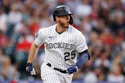 Jul 2, 2021; Denver, Colorado, USA; Colorado Rockies first baseman C.J. Cron (25) hits an RBI double in the sixth inning against the St. Louis Cardinals at Coors Field. Mandatory Credit: Isaiah J. Downing-USA TODAY Sports