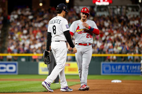 Jul 2, 2021; Denver, Colorado, USA; Colorado Rockies third baseman Joshua Fuentes (8) talks with his cousin, St. Louis Cardinals third baseman Nolan Arenado (28) in the tenth inning at Coors Field. Mandatory Credit: Isaiah J. Downing-USA TODAY Sports