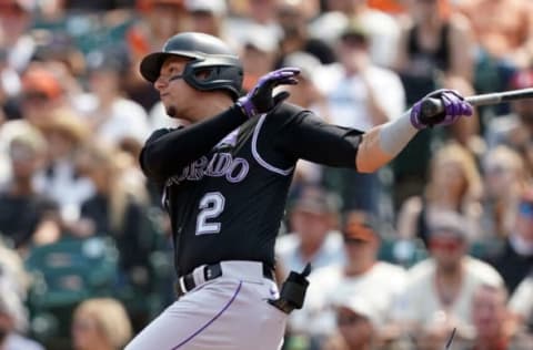 Aug 15, 2021; San Francisco, California, USA; Colorado Rockies right fielder Yonathan Daza (2) hits a single during the seventh inning against the San Francisco Giants at Oracle Park. Mandatory Credit: Darren Yamashita-USA TODAY Sports