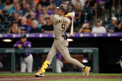 San Diego Padres shortstop Jake Cronenworth (9) hits an inside the park home run in the seventh inning against the Colorado Rockies at Coors Field. Mandatory Credit: Isaiah J. Downing-USA TODAY Sports