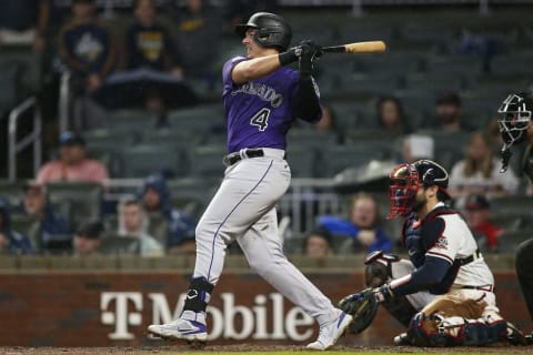 Sep 15, 2021; Atlanta, Georgia, USA; Colorado Rockies third baseman Colton Welker (4) hits a single against the Atlanta Braves in the fifth inning at Truist Park. Mandatory Credit: Brett Davis-USA TODAY Sports