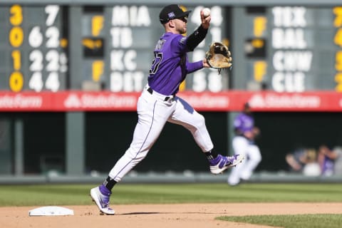 Sep 26, 2021; Denver, Colorado, USA; Colorado Rockies shortstop Trevor Story (27) makes a throw to first base for an out against the San Francisco Giants in the seventh inning at Coors Field. Mandatory Credit: Michael Ciaglo-USA TODAY Sports