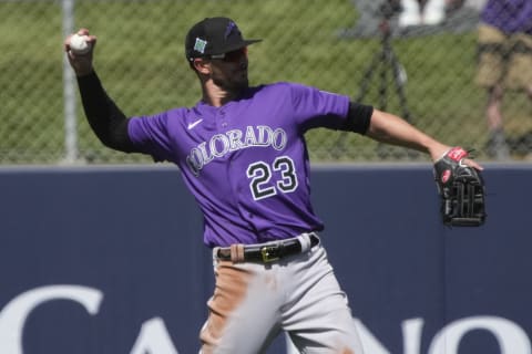 Mar 22, 2022; Tempe, Arizona, USA; Colorado Rockies left fielder Kris Bryant (23) warms up in the first inning during a spring training game against the Los Angeles Angels at Tempe Diablo Stadium. Mandatory Credit: Rick Scuteri-USA TODAY Sports