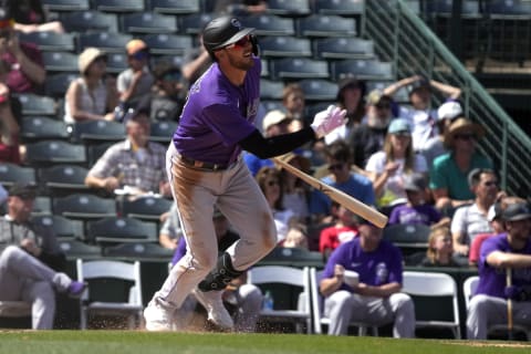 Mar 22, 2022; Tempe, Arizona, USA; Colorado Rockies left fielder Kris Bryant (23) hits against the Los Angeles Angels in the fourth inning during a spring training game at Tempe Diablo Stadium. Mandatory Credit: Rick Scuteri-USA TODAY Sports