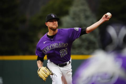 Apr 19, 2022; Denver, Colorado, USA; Colorado Rockies starting pitcher Kyle Freeland (21) delivers a pitch in the first inning against the Philadelphia Phillies at Coors Field. Mandatory Credit: Ron Chenoy-USA TODAY Sports